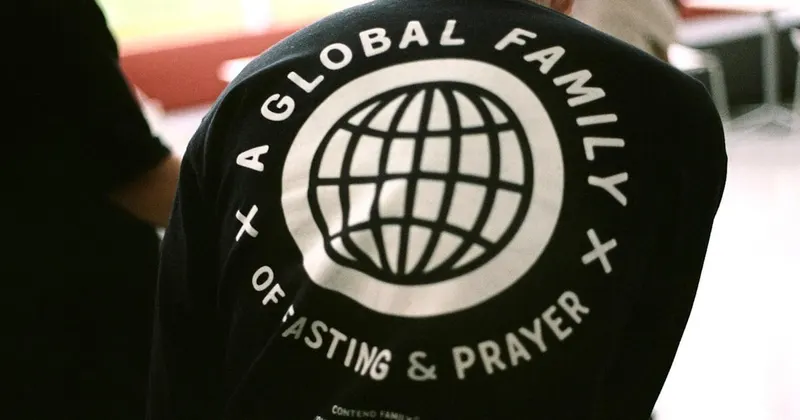 A group of people standing around a building